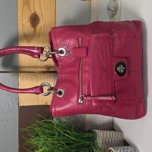 Coach Legacy Pebbled leather tote bag in a bright pink color